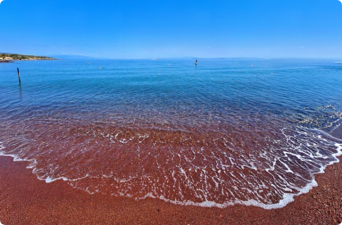 Tsonia beach red sand and clear water, north coast Lesvos