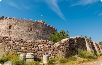 Mytilene Castle Byzantine walls in pine forest above the harbor, Lesvos