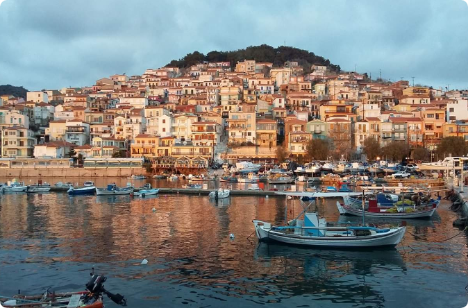 Plomari village stone houses and harbor at sunset, ouzo capital of Greece